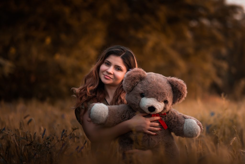 woman holding a teddy bear